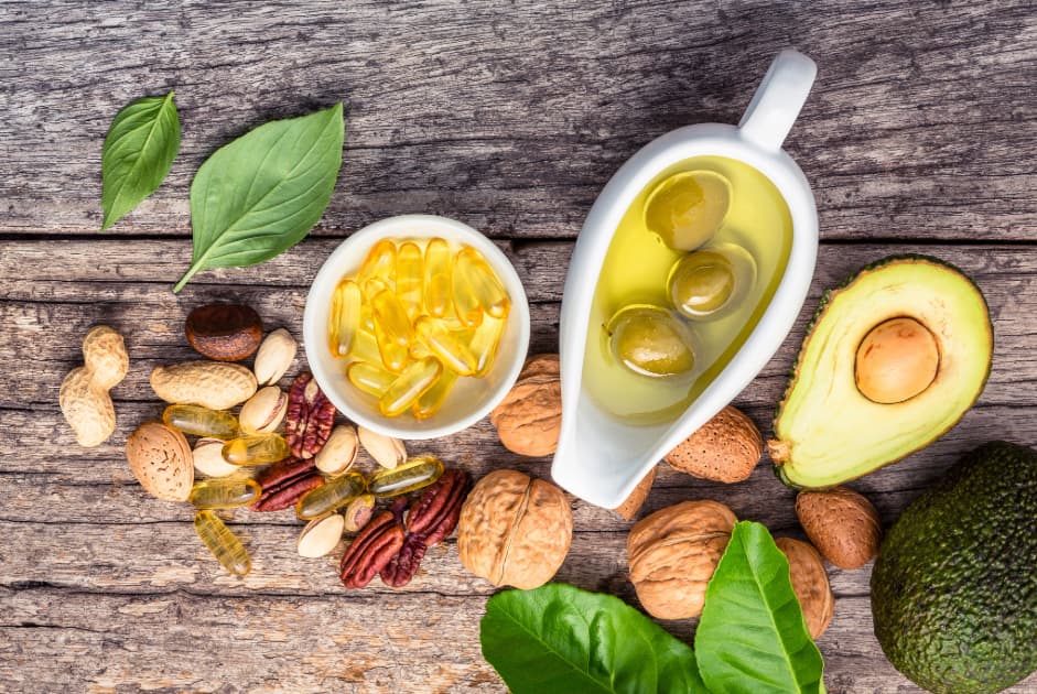 image of good sources of fats and oils including avocado. olives and olive oil, and nuts