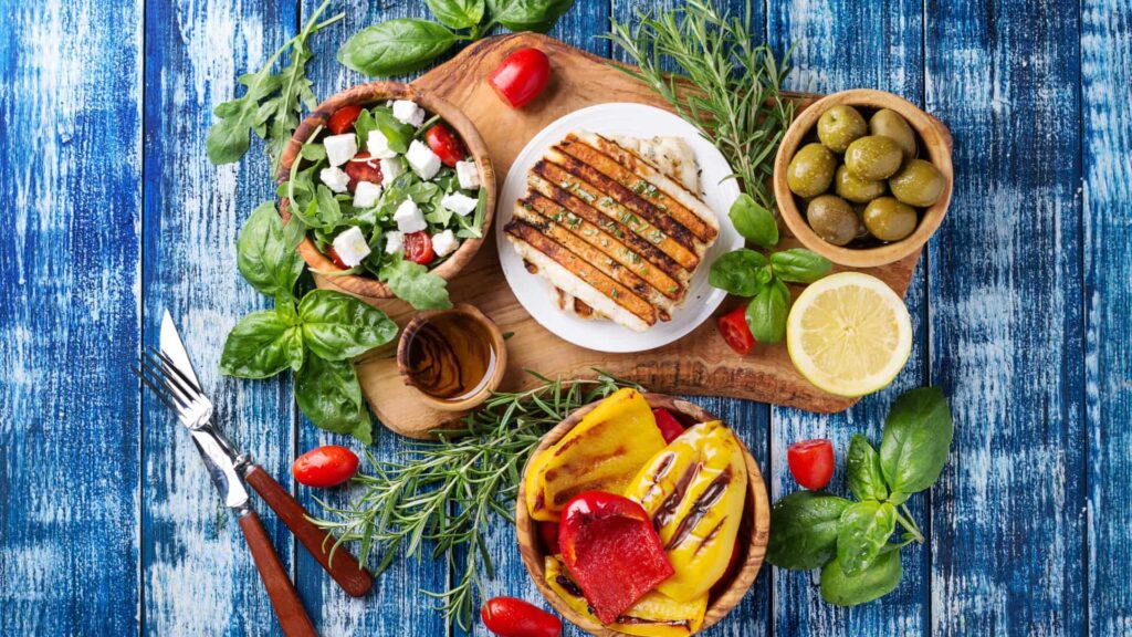 image of ingredients to make a Greek salad in separate bowls