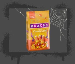 Halloween Sugar image of candy corn behind a spider web