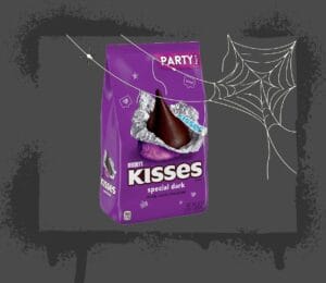Halloween Sugar image of dark chocolate kisses behind a spider web