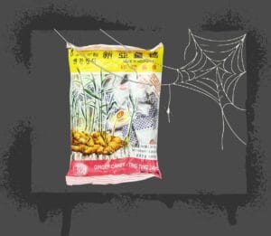 Halloween Sugar image of ginger candy behind a spider web