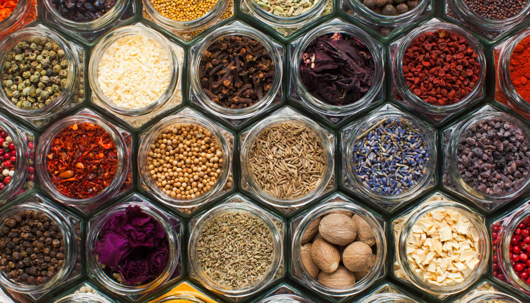 Image of several colorful, tightly packed jars with spices