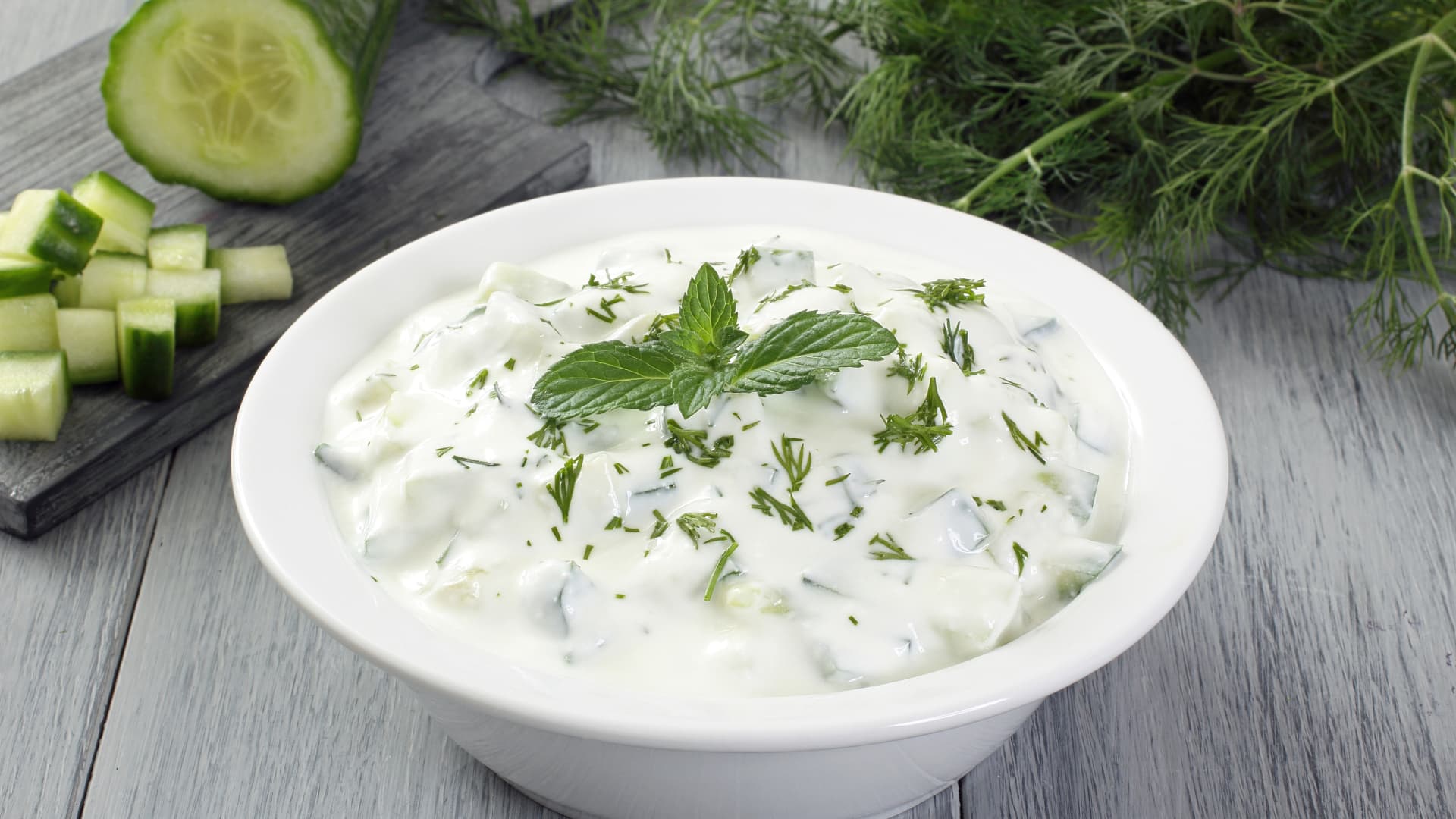 Image of Tzatziki sauce with a sprig of mint