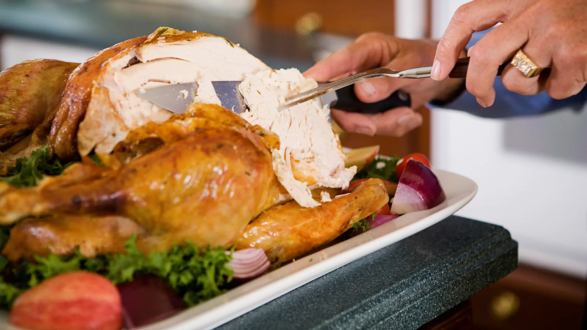 the image of a turkey being carved