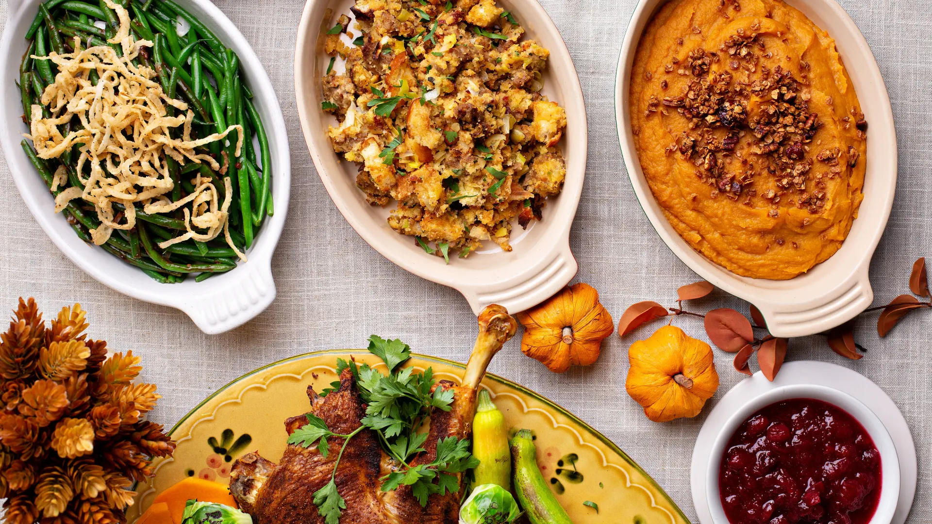 image of side dishes for thanksgiving, potatoes, pumpkin puree, cranberry sauce, and green beans
